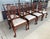 This set of eight Hickory Chair dining chairs features classic Chippendale-inspired styling with pierced carved splat...