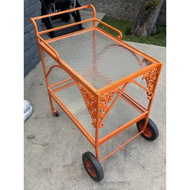 1950s- 1960s wrought iron bar cart. Attributed to Russell Woodard design. Any marks that can attribute this item were...