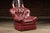 Generously proportioned lounge chair with a coordinating ottoman, upholstered in rich burgundy leather. The chair features...