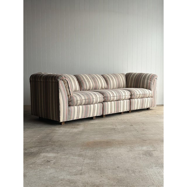 Vintage modular sectional sofa with a pillow-top back and arm rail. Three individual pieces allow flexible configurations...