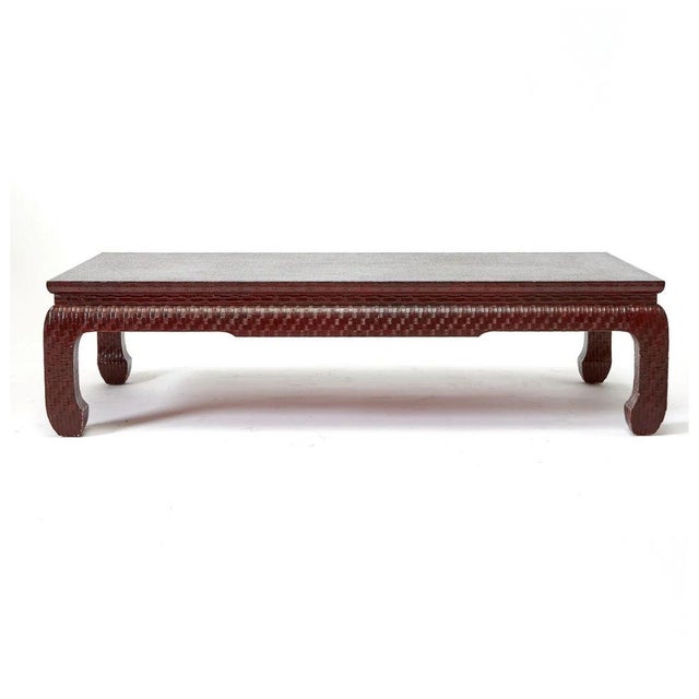 A Karl Springer inspired Asian style low coffee table wrapped in textured raffia and sealed with a high-gloss lacquer with...