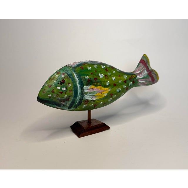 Needing a bright colored accessory to add to your coastal or nautical space? Then consider this fish figurine a 'keeper'...