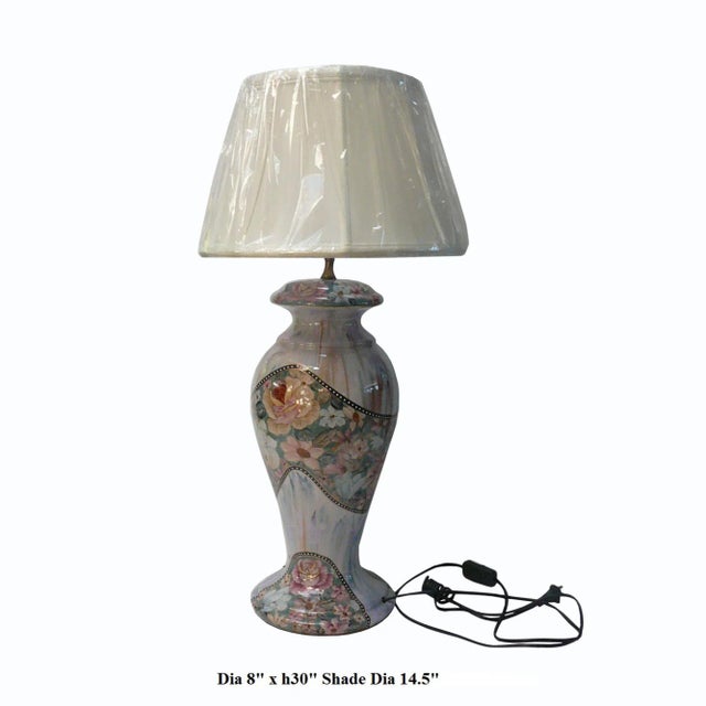 This is a table lamp with a porcelain pinkish color vase shape base in a floral pattern. Dimensions: Dia 8"x with shade...