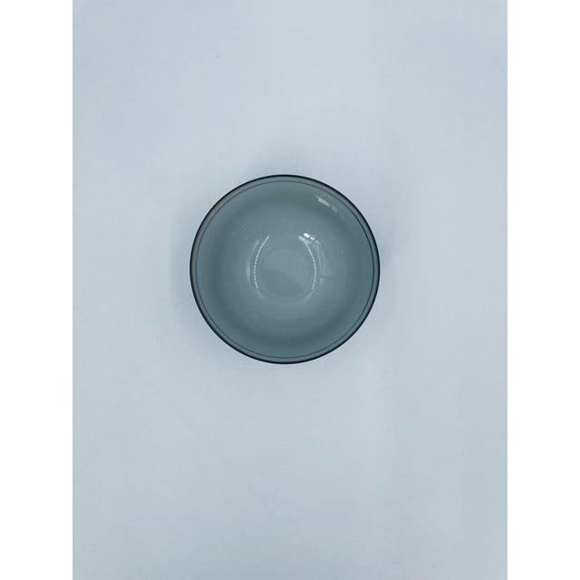 A traditional Japanese rice bowl in the Arita style, made of high-quality porcelain. The bowl features a classic, hand-...