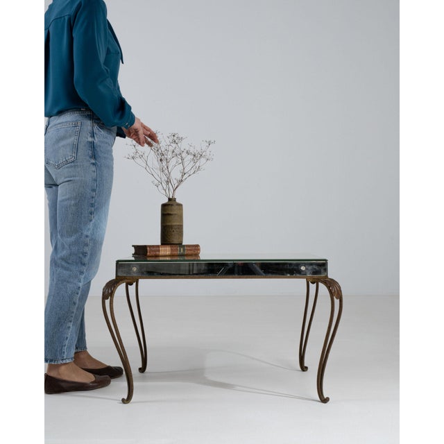 Here is a console table, its mirrored glass top, gilt wood scroll leg the first thing to catch the eye. Dating to 1950s...