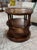 Theodore Alexander round 3-tier dark wood & leather side table. Six turned supports join the three leather-clad surfaces....