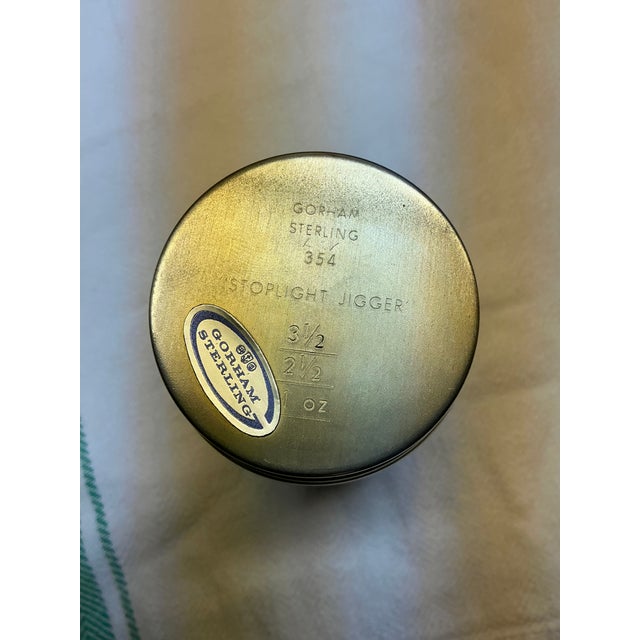 This item is a vintage Gorham sterling silver "Stoplight Jigger" featuring red, yellow, and green enamel traffic lights....