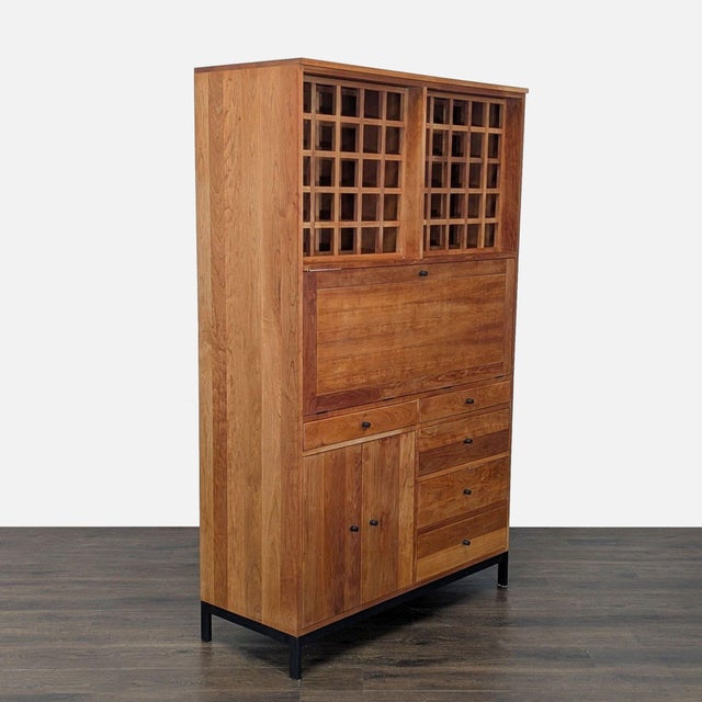 Cherry wood and steel cabinet. Cabinet holds 50 bottles of wine, has 5 drawers, cabinet with shelf, and pull-out bar...
