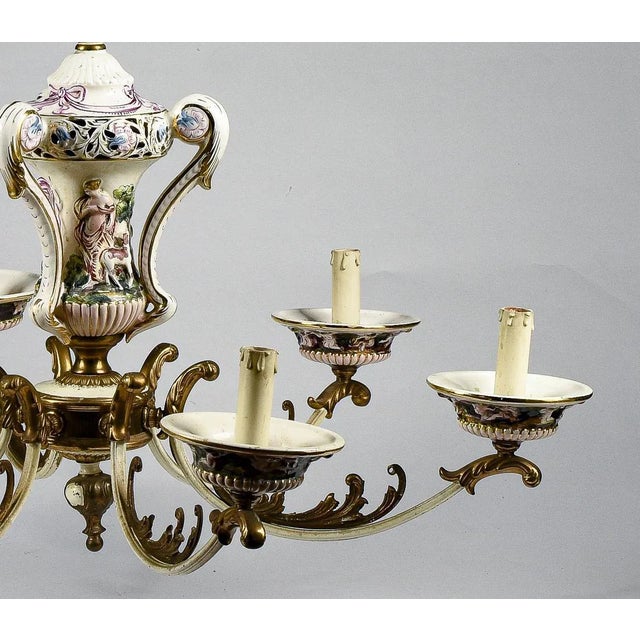 Colored and pierced painted porcelain chandelier capodimonte style production italy 1960. The chandelier is complete with...