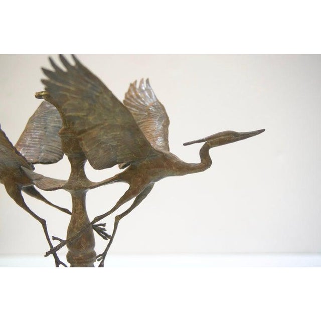 Artisan Ltd Edition bronze crane motif candleholders Signed Dm 97 AM 7/200 and AM 8/200. - a pair. In normal light these...