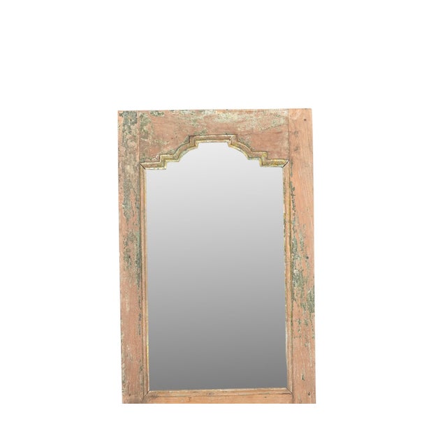 Indian Carved Teakwood Mirror Made From a Vintage Window Panel, in a natural color of teak with an intricately carved...