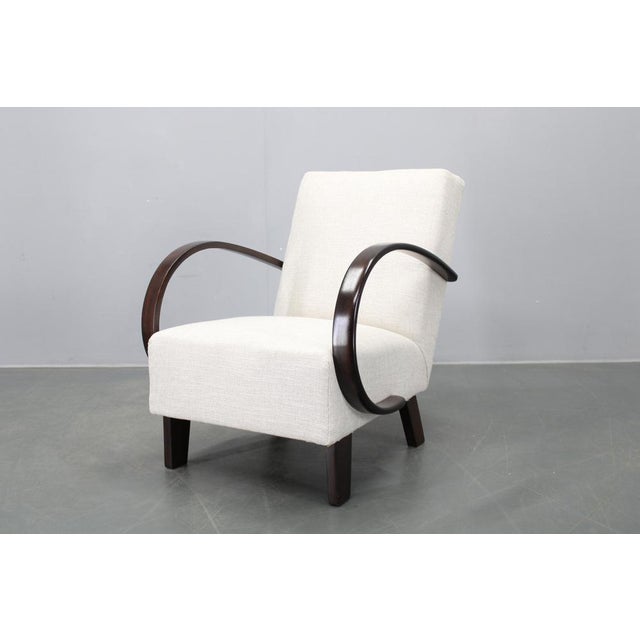 An authentic Art Deco armchair designed by Jindřich Halabala, one of the most influential figures of Czechoslovak...