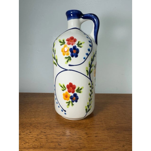 Beautiful vintage ceramic vase, hand painted in Spain with classic floral folk art motifs. The vibrant colors and...