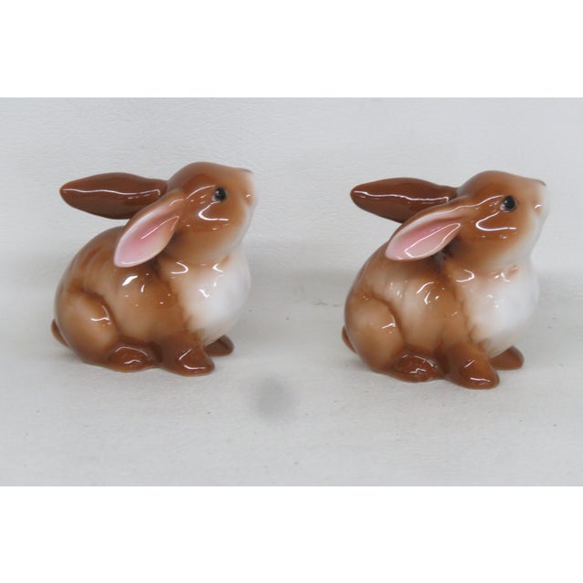 This Pair of charming miniature figurines is made of porcelain. This lovely piece is stamped as being made by Goebel in...
