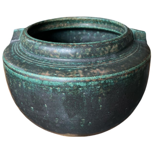 Powerful hand-thrown earthenware vase with a deeply textured verdigris-style glaze, strongly evocative of oxidized bronze...