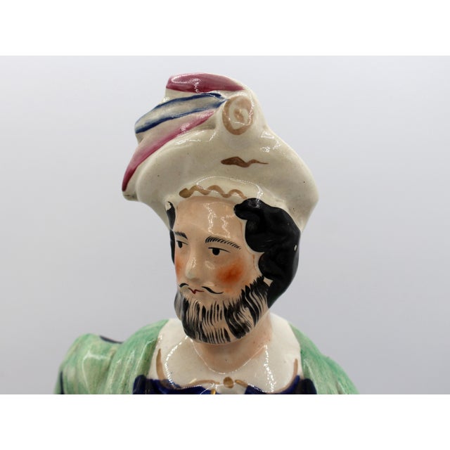 Circa 1860 Staffordshire figure of "The Lion Slayer", English. Large & imposing - a Scottish Highlander with sword drags...