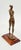 Courage is a powerful and expressive bronze figurine that captures a moment of quiet strength and self-assurance. With her...