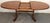 A striking Mid-Century Modern dining table by G-Plan, known as the iconic “Whale Tail” model. Crafted in richly grained...