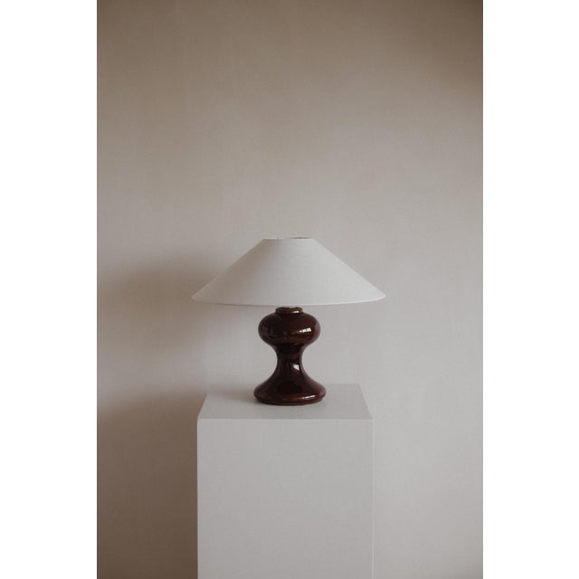 The Cordovan Hourglass Table Lamp in Ceramic, in Very Good conditions. Designed 1970 to 1979 European Plug (up to...