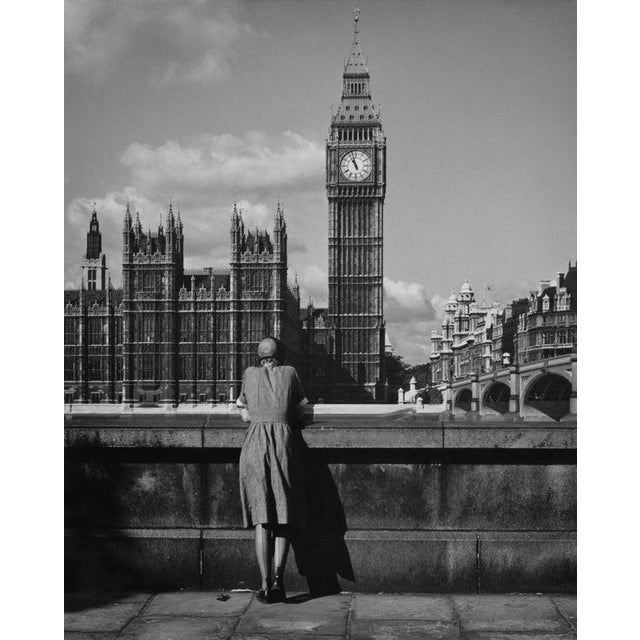 Big Ben From The South Bank A woman looking across the Thames towards the Palace of Westminster, London, circa 1955....