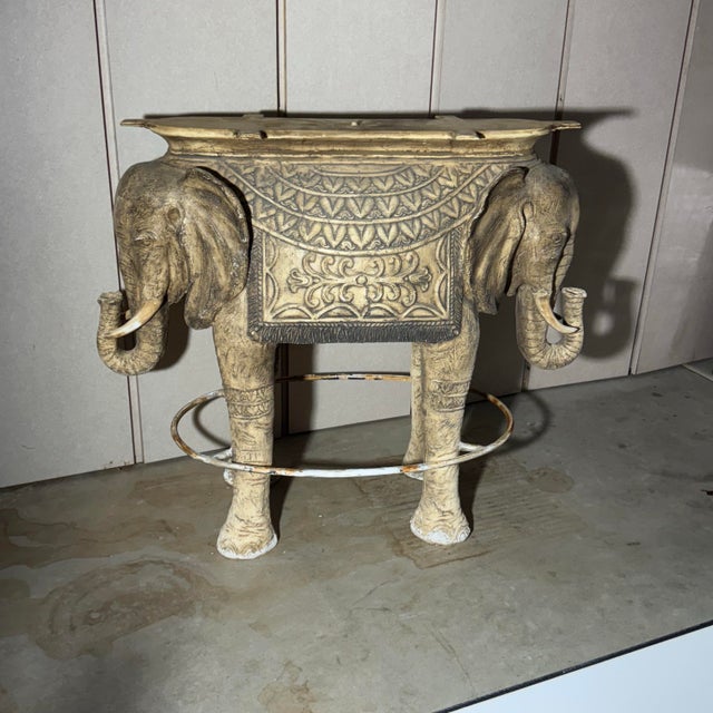 ~ Bring a statement piece into your home, patio, or garden with this unique elephant table base. Featuring two intricately...