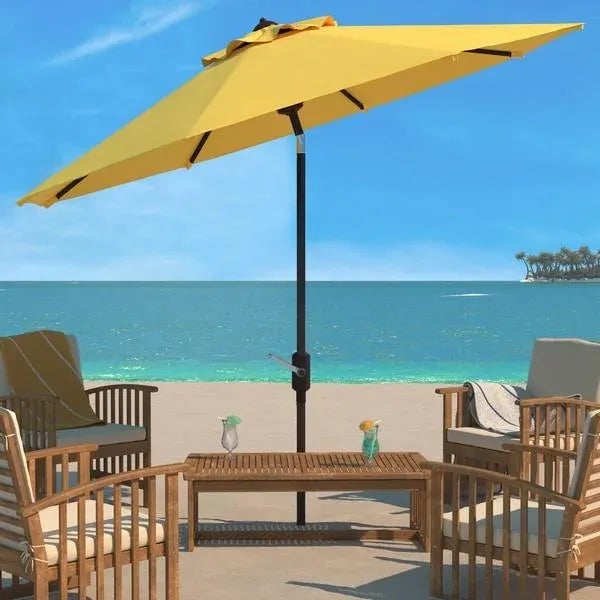Conjure images of dining al fresco at a romantic café on the Riviera with this yellow Ortega Umbrella. Keep cool on your...