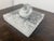 Design Plus Gallery presents a Rock Crystal Sculpture by Robert Kuo. The piece has a pepper that is resting on a square...