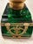 Striking emerald green glass inkwell in the French Empire style, accented with ornate gilt metal mounts and classical...