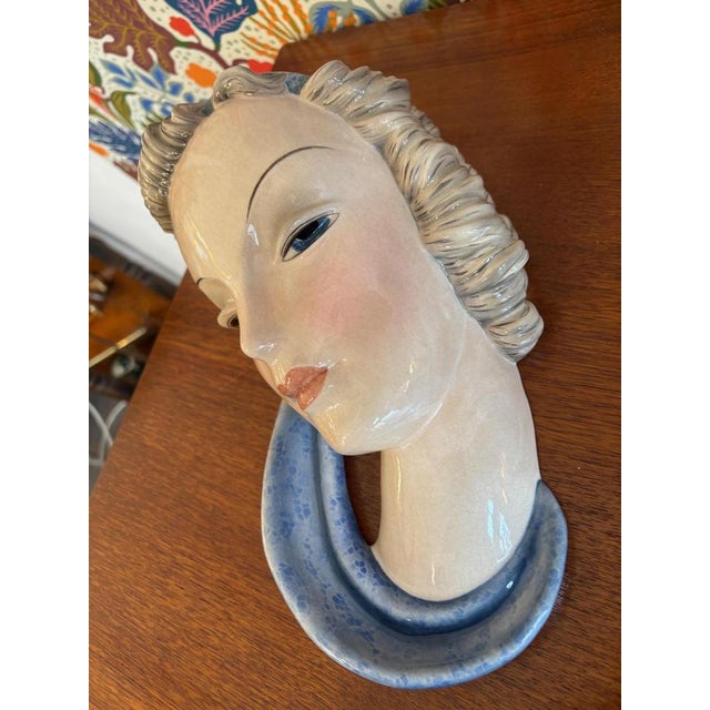 Wall mask of a woman's head by Adolf Prischl from the 1920s. Manufactured by Goldscheider Vienna. Ceramic, painted,...