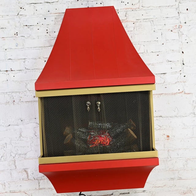 Incredible vintage Mid-Century Modern electric wall fireplace square orange frame with gold tone trim, artificial logs,...