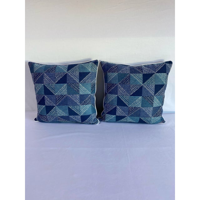 Custom made geometric indoor/outdoor pillows with white piping edges. Invisible zipper and feather down insert included.