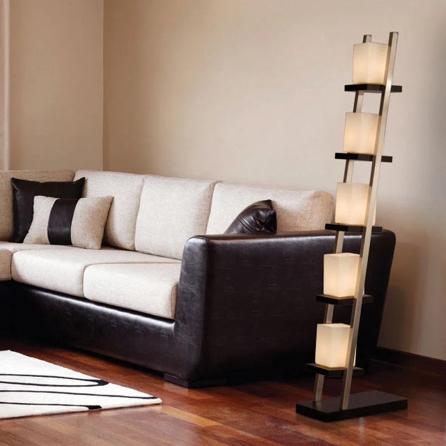 Bring warmth, structure, and modern sophistication into your space with the Escalier Floor Lamp by NOVA of California....