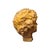 Child's head following classical Roman models, made in a mold in a patinated stone-like material.