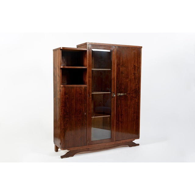 This elegant antique French Art Deco vitrine display cabinet or bookcase was made in France circa 1940. Beautifully...