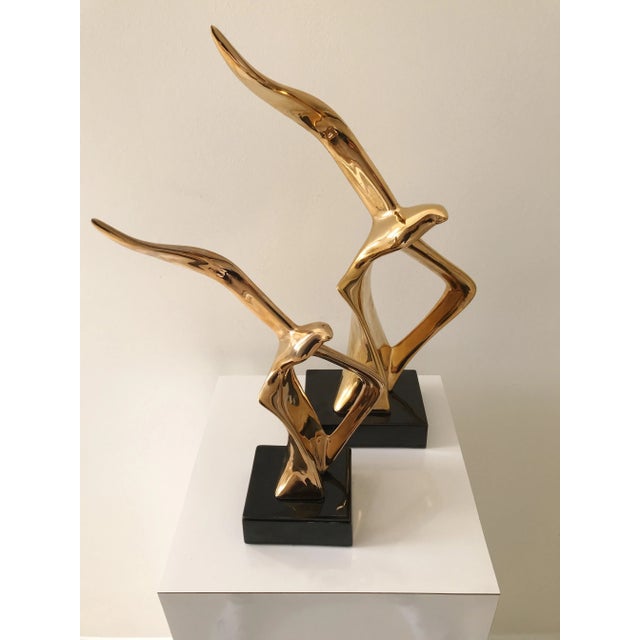 Add some sophisticated glamour to your abode or office. Two (a pair) vintage brass plated Soaring Bird Sculptures made by...
