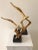 Add some sophisticated glamour to your abode or office. Two (a pair) vintage brass plated Soaring Bird Sculptures made by...