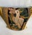 This decorative pillow is upholstered with an authentic 18th-century tapestry, showcasing a beautifully detailed bird...
