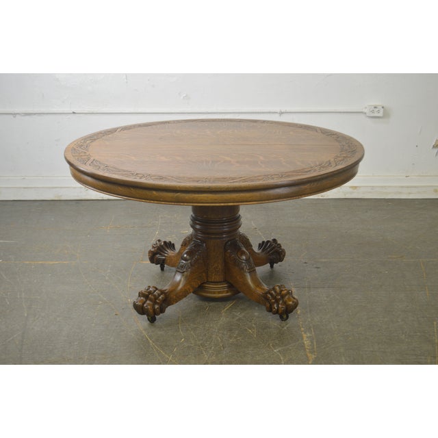 Hastings Antique Tiger Oak 54" Round Carved Claw Foot Dining Table