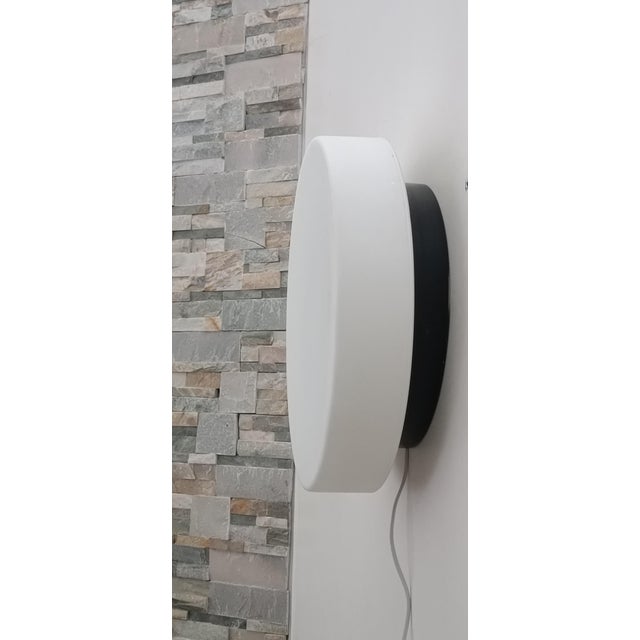Magnificent wall sconce by Luxus Sweden. Sweden, 1970s. Minimalist and functional Scandinavian design. Black lacquered...