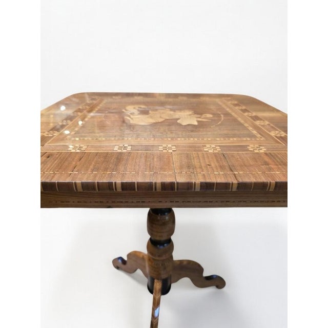 A small Italian side table from the Sorrento region, dating from the 19th century. The central marquetry depicts Saint...