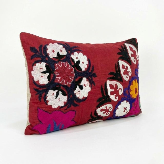 This beautiful 20'' x 28'' hand-embroidered Suzani pillow cover was made from authentic Uzbek cotton fabric. The intricate...