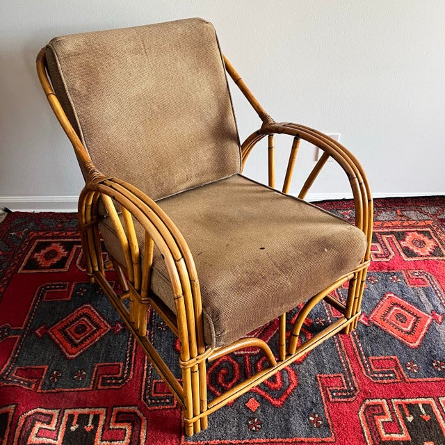 Mid Century bent bamboo & rattan lounge chair. Dimensions: 25"W x 33.5"D x 30.5"H Seat 11.5"H Seat w/ cushion 16"H