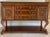 Neo Classical banded wood console table with rich Marble Top. Made by Universal Furniture Company. Intricate carving below...