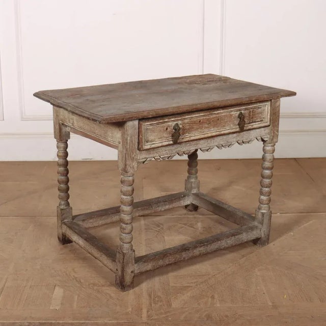 17th C English limed oak one drawer lamp / side table. 1690. This piece is designed in the style of the selected designer...