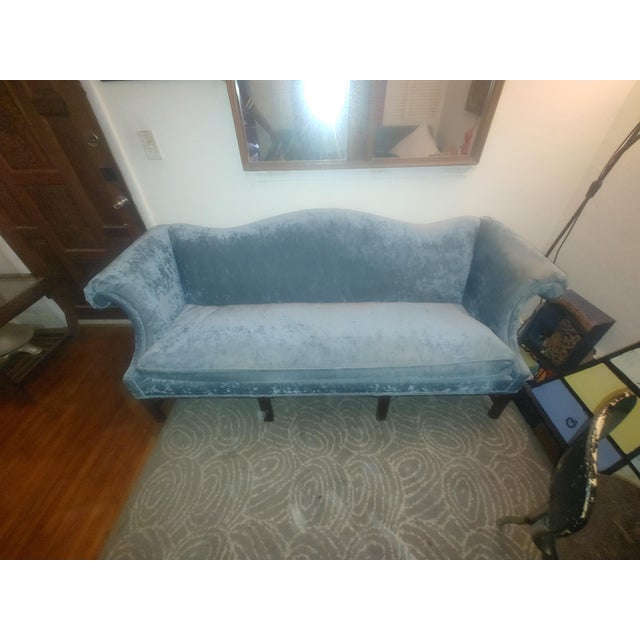 Vintage 1980s era camelback sofa, upholstered in a gorgeous light blue velvet silk fabric. Down filled, this sofa provides...