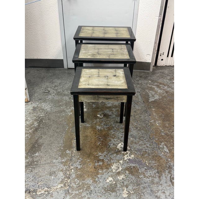 Design Plus Gallery presents a Set of Three Nesting Tables from Neiman Marcus. The trio offers a graduated profile with...