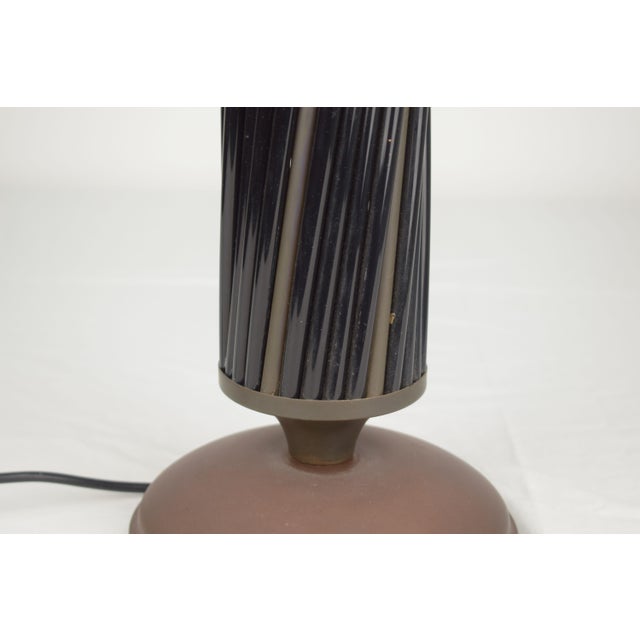 Elegant Italian table lamp from the 1970s, featuring a simple and refined design that combines natural and industrial...