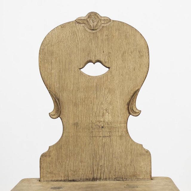 Traditional antique mountain chair from southern Germany. This characteristic and primitive chair is entirely handmade and...