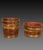 A duo of early C19th coopered buckets, of tapering form, one circular, one oval, both finished in the original grained...