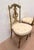 Pair of louis xvi style giltwood chairs four turned, fluted legs lyre-decorated backrests stable chairs one chair is...